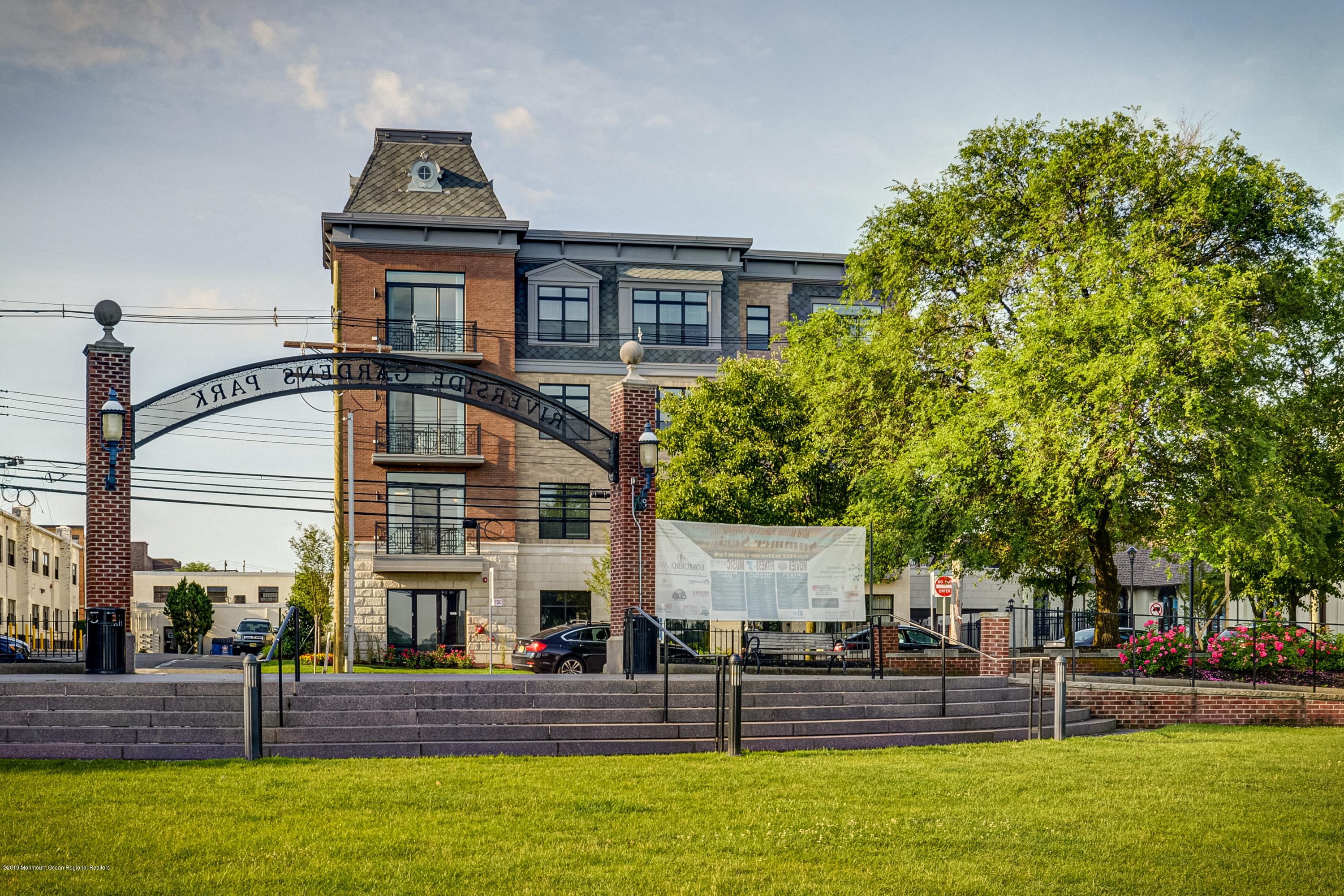 55 West Front Street, Unit 301 Red Bank, NJ 07701 - Photo 2 of 26 a front view of a building with garden