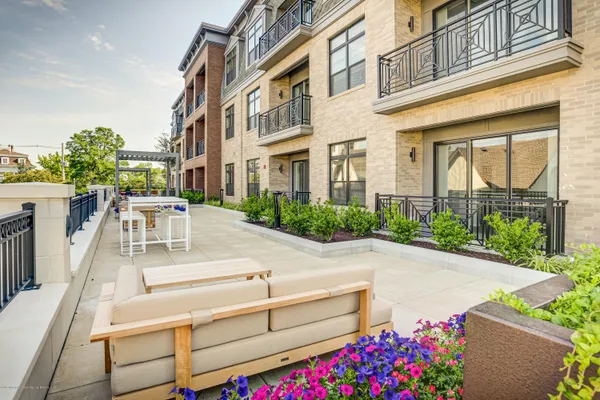 a view of a patio with table and chairs and potted plants