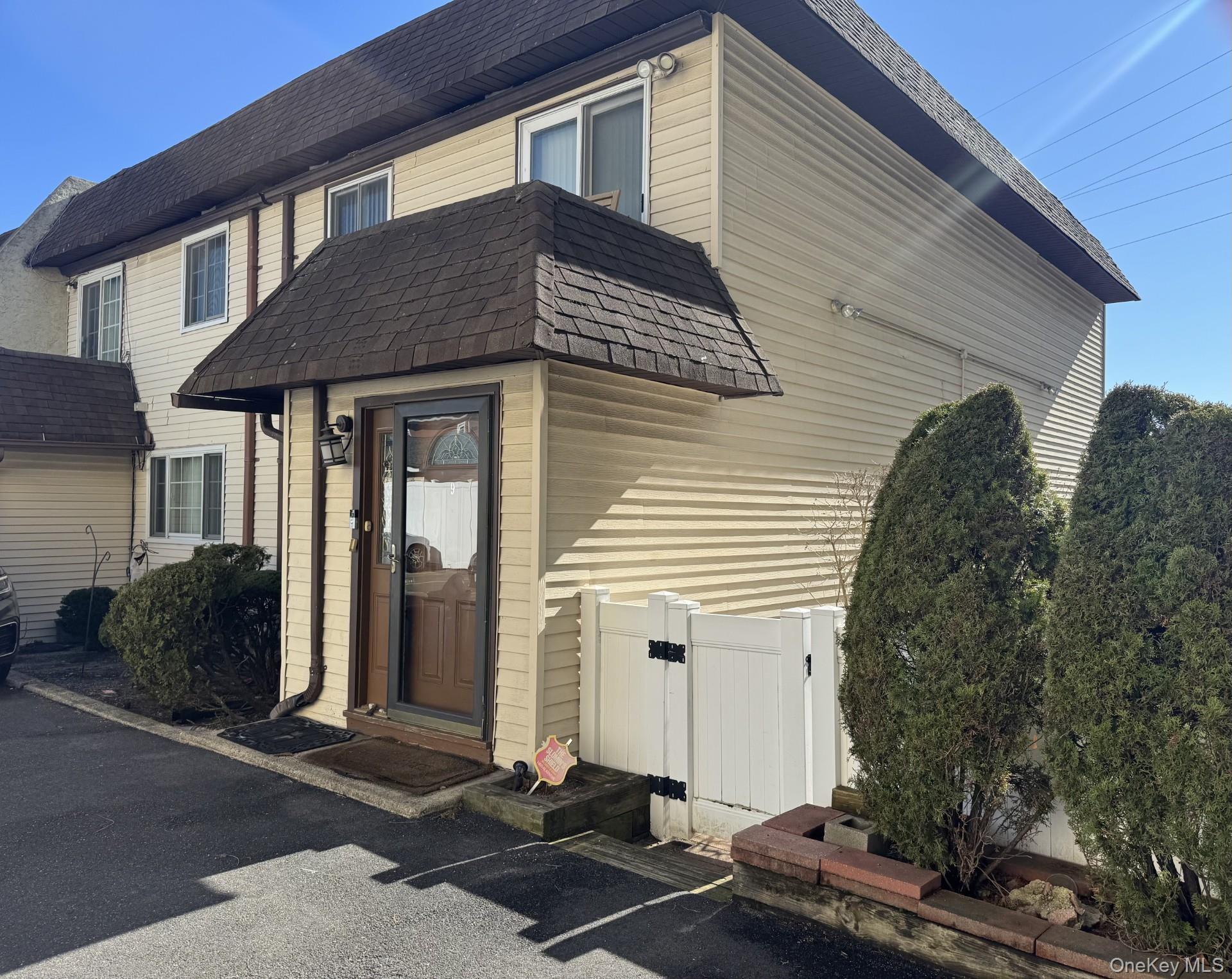 88 East Valley Stream Boulevard, Unit 9 Valley Stream, NY 11580 - Photo 2 of 17 a front view of house with yard