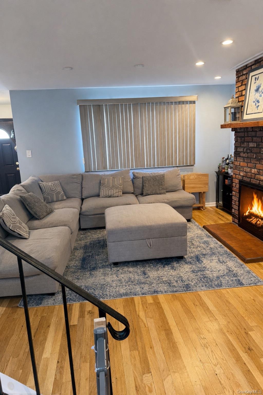 88 East Valley Stream Boulevard, Unit 9 Valley Stream, NY 11580 - Photo 4 of 17 a living room with furniture and a fireplace