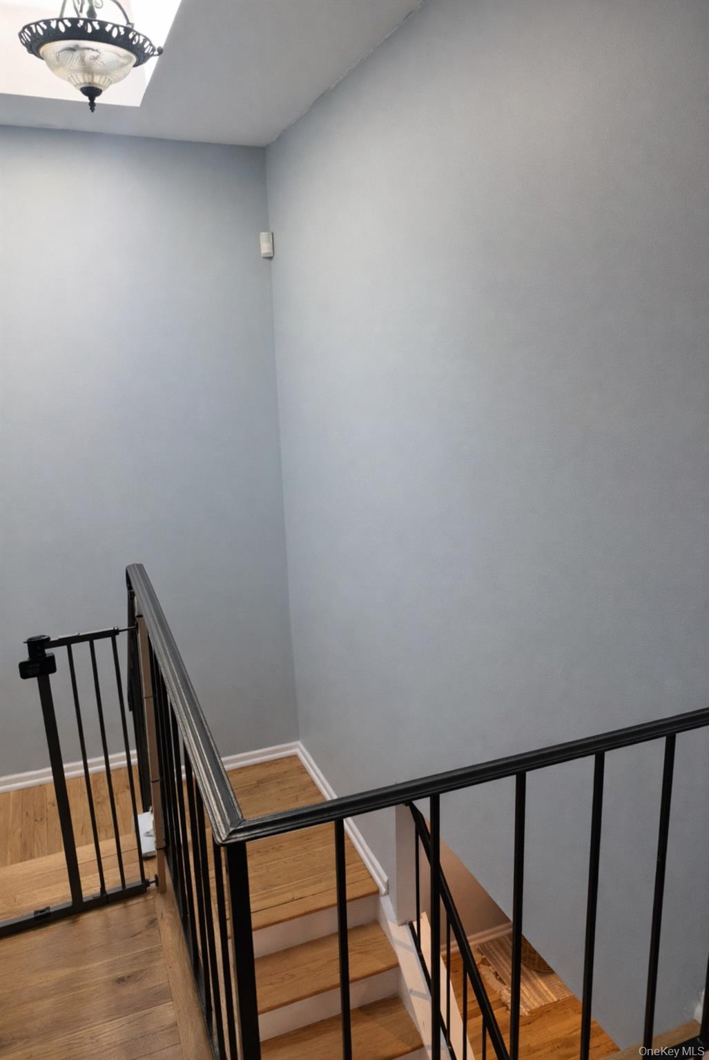 88 East Valley Stream Boulevard, Unit 9 Valley Stream, NY 11580 - Photo 10 of 17 a view of staircase with railing and a window