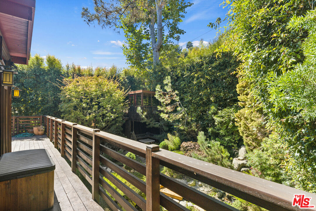473 West Rustic Road Santa Monica, CA 90402 - Photo 22 of 25 a view of balcony with wooden floor and fence