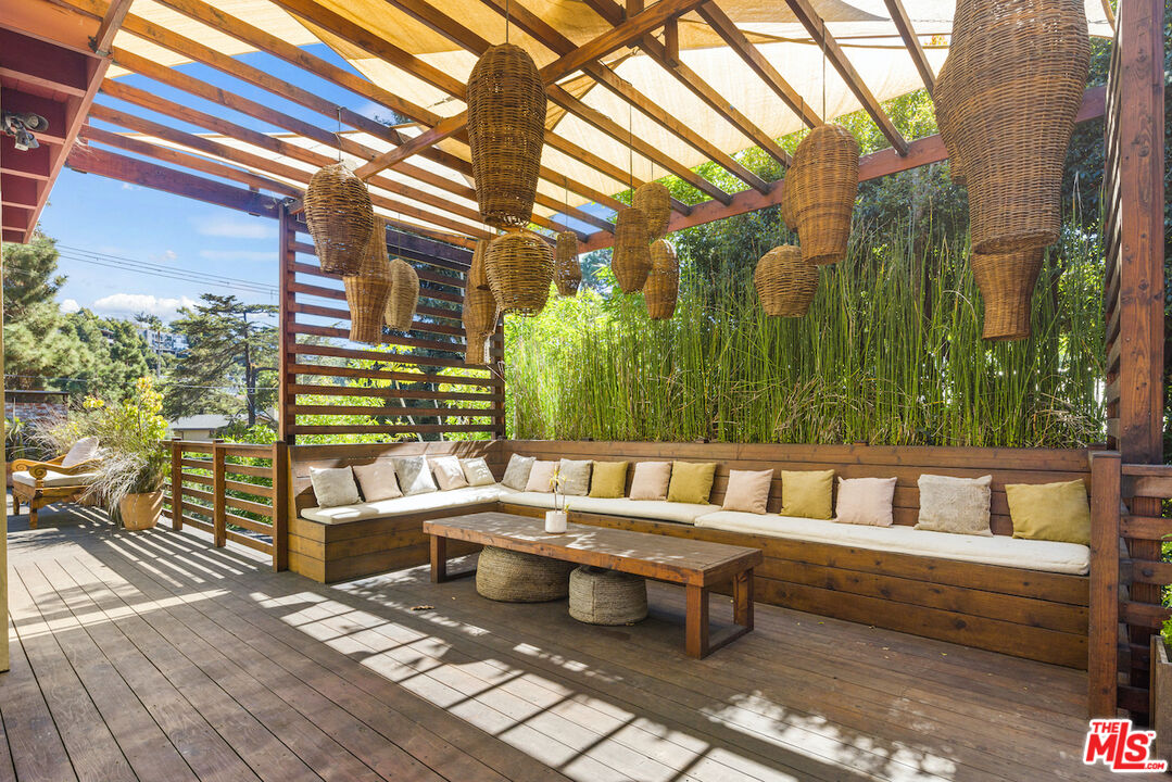 473 West Rustic Road Santa Monica, CA 90402 - Photo 23 of 25 a outdoor sitting area with couch and wooden fence