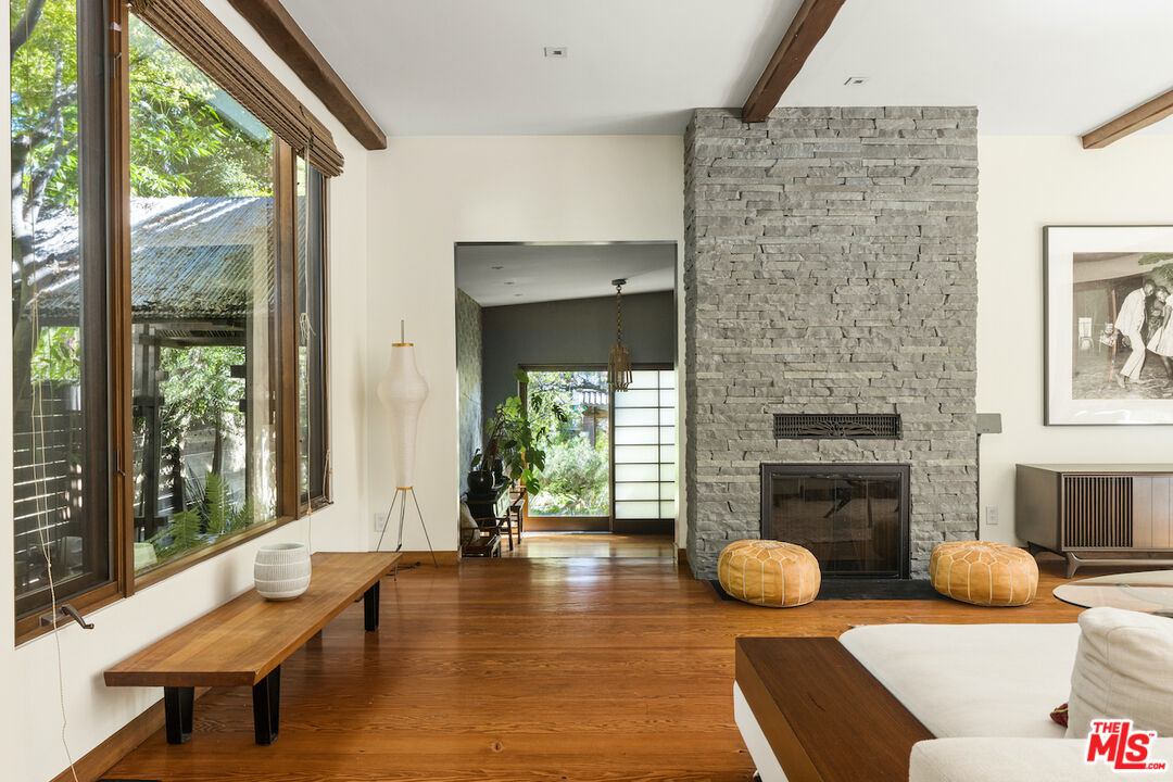 473 West Rustic Road Santa Monica, CA 90402 - Photo 5 of 25 a living room with furniture and a fireplace