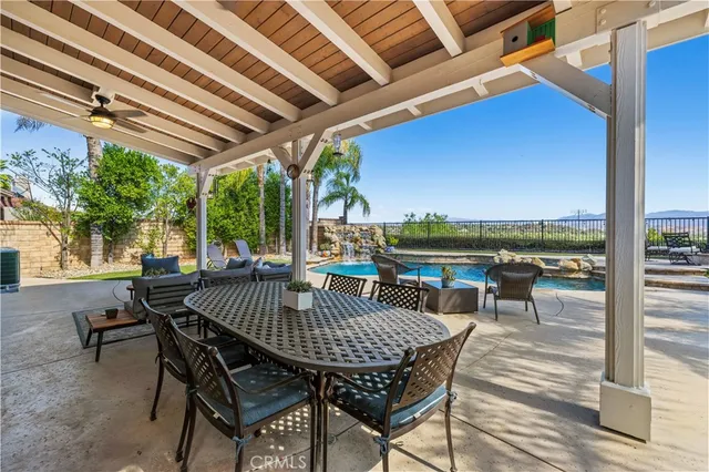 a view of a patio with a table chairs and a patio