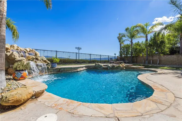 a view of a swimming pool with a lounge chairs
