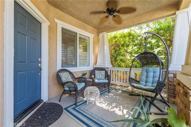 a balcony view with a seating space