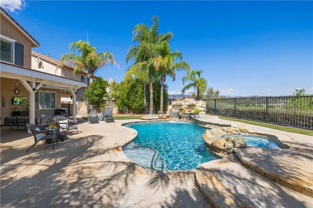 a view of a swimming pool with a patio