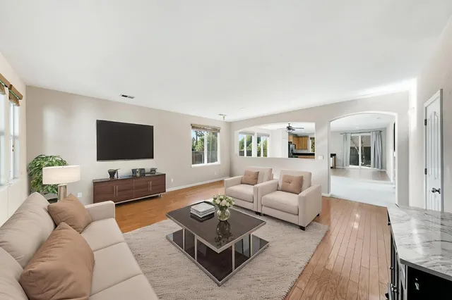 a living room with furniture and a flat screen tv