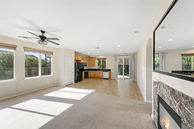 a view of a kitchen with a sink and a large window