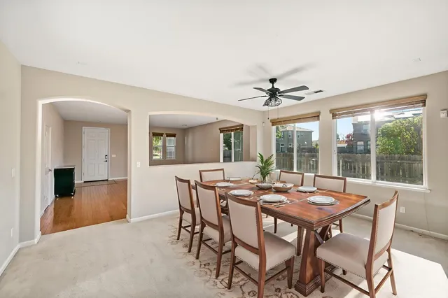 a view of a dining room with furniture window and outside view