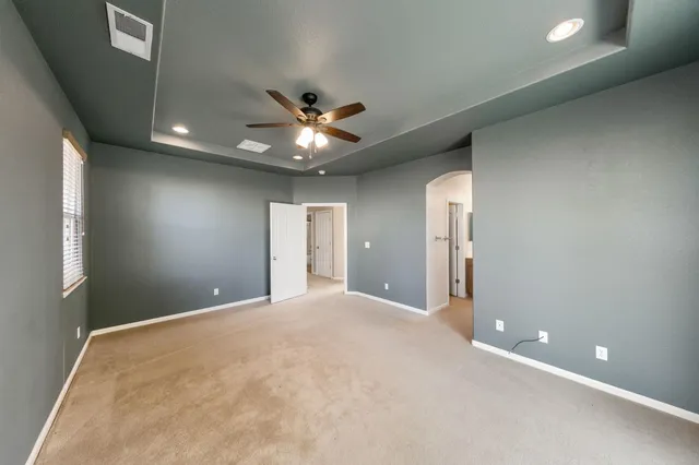 a bathroom with a shower sink and mirror