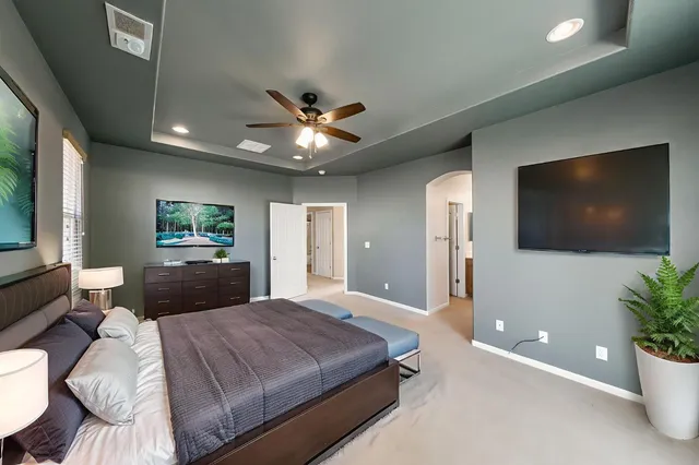 a bathroom with double vanity and a mirror