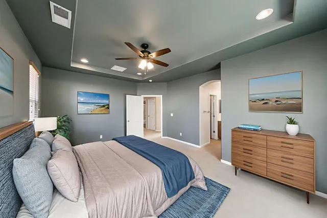 a bathroom with a sink vanity mirror and toilet
