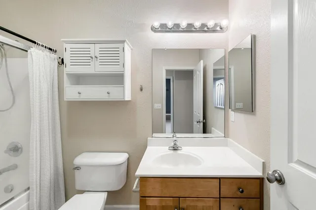 a bed room with a bed and a lamp