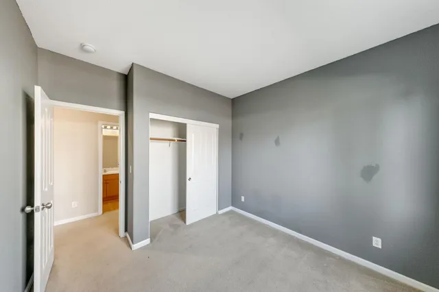 a view of a patio with table and chairs and potted plants
