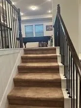 a bathroom with a granite countertop sink a mirror and a bathtub