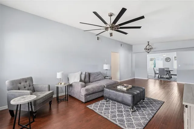 a living room with furniture and a rug