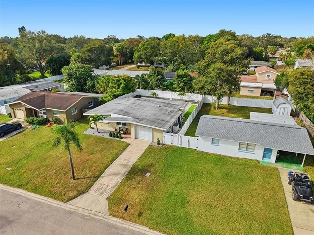 an aerial view of a house with swimming pool garden and mountain view