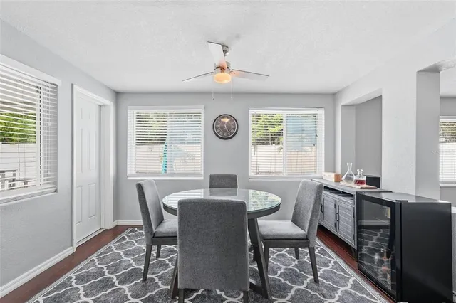 a view of a dining room with furniture window and outside view
