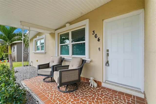 a living room with patio furniture