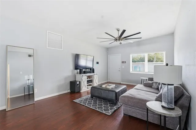 a living room with furniture and a window