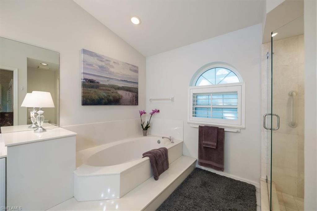 203 Via Perignon, Unit 24 Naples, FL 34119 - Photo 22 of 42 Primary bathroom with natural light