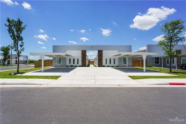 a house view with swimming pool and a yard