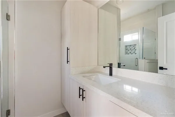a bathroom with a sink and a mirror