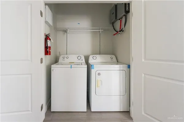 a utility room with dryer and washer