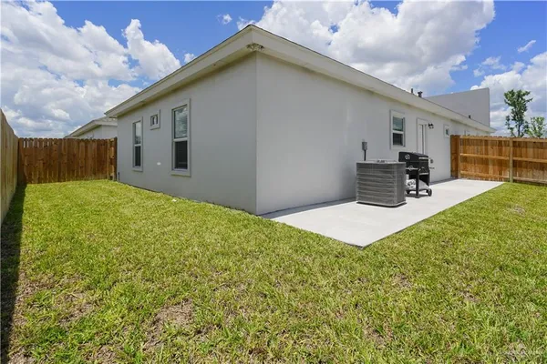a house view with a backyard space