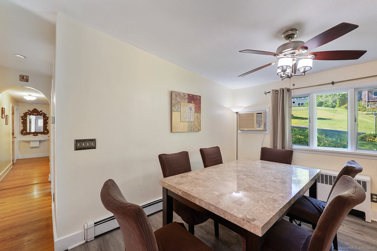 26 Wilridge Road Ridgefield, CT 06877 - Photo 19 of 40 a view of a dining room with furniture a chandelier and wooden floor