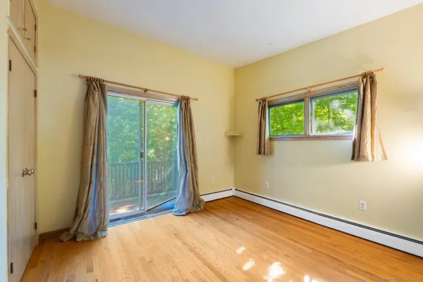 a bedroom with a bed and cabinets