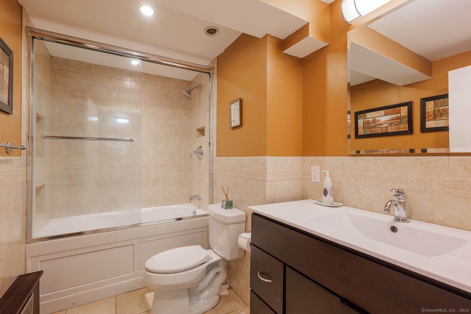 26 Wilridge Road Ridgefield, CT 06877 - Photo 30 of 40 a bathroom with a double vanity sink mirror and toilet