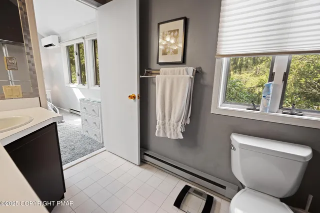 a bathroom with a toilet sink and tub