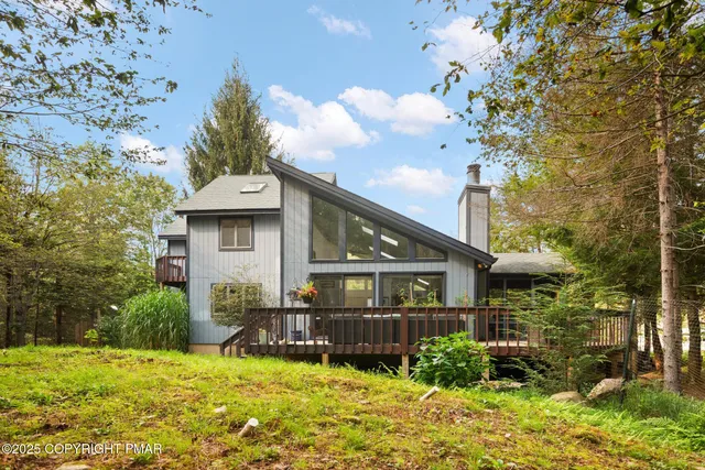 a view of a house with a chairs in a patio