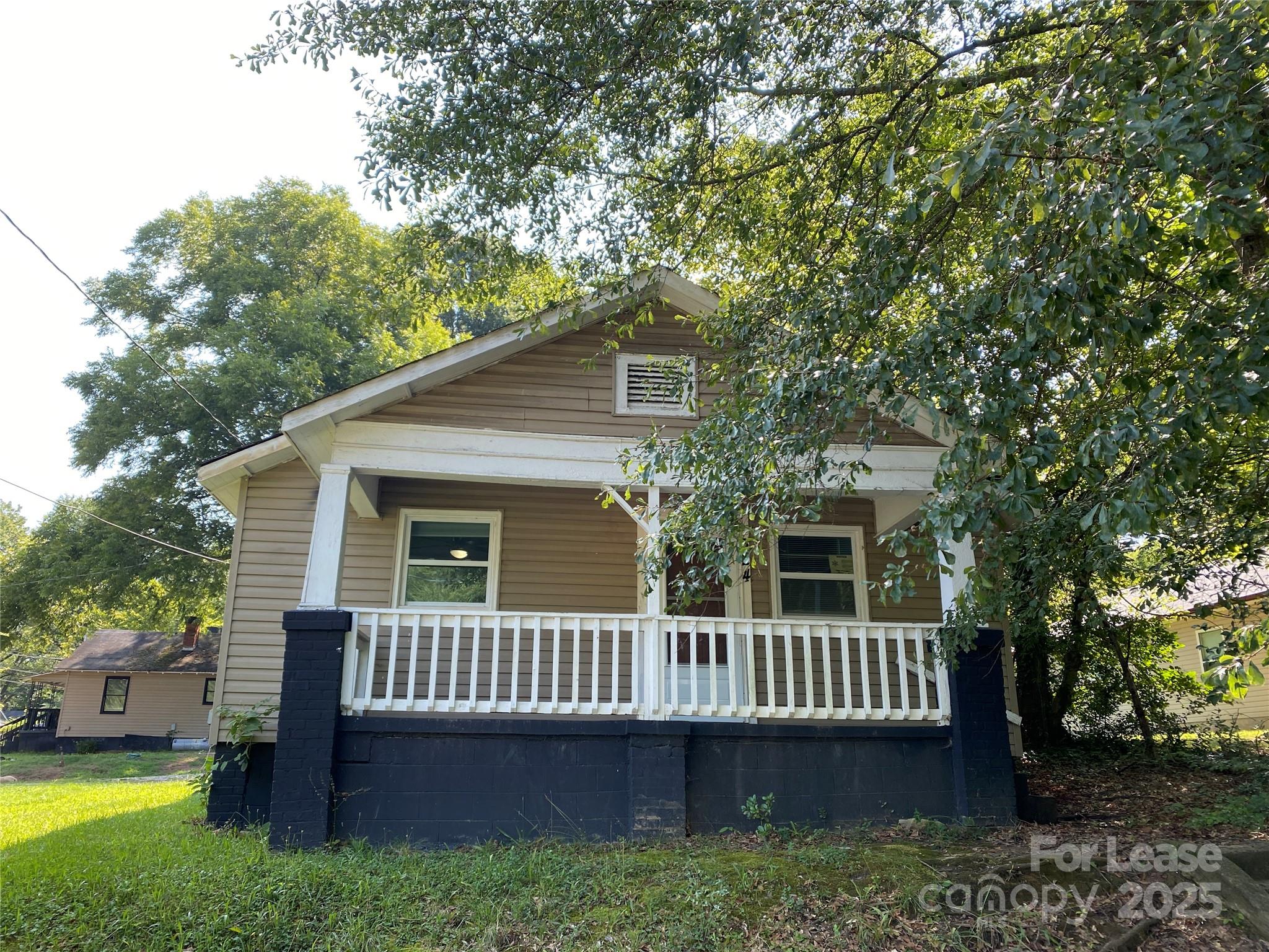 324 North Pryor Street Gastonia, NC 28052 - Photo 1 of 9 a view of a house with a deck and a yard