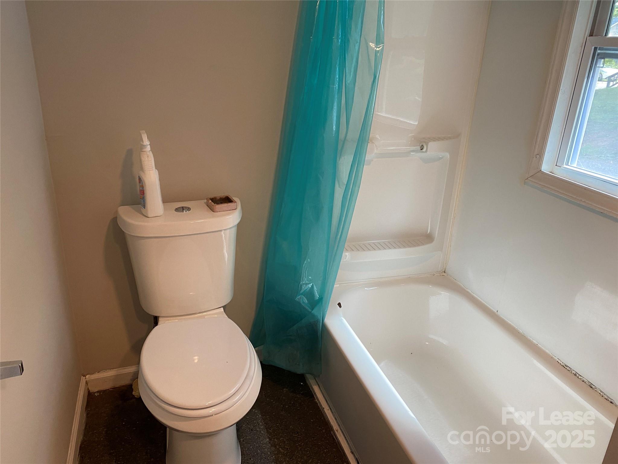324 North Pryor Street Gastonia, NC 28052 - Photo 7 of 9 a bathroom with a sink and a toilet