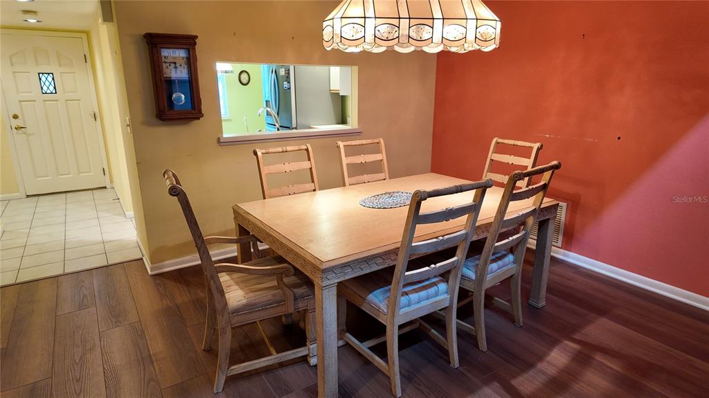 1767 Southeast 27th Loop Ocala, FL 34471 - Photo 20 of 79 a view of a dining room with furniture and chandelier