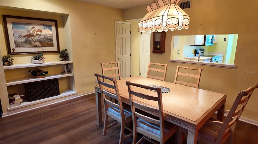 1767 Southeast 27th Loop Ocala, FL 34471 - Photo 21 of 79 a view of a dining room with furniture and wooden floor