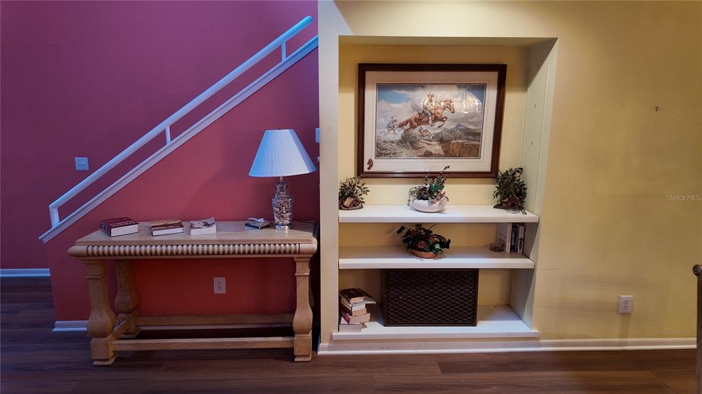 1767 Southeast 27th Loop Ocala, FL 34471 - Photo 22 of 79 a room with painting on the wall and a potted plant