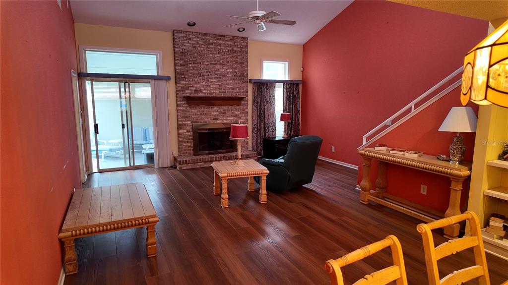 1767 Southeast 27th Loop Ocala, FL 34471 - Photo 23 of 79 a living room with furniture and a fireplace