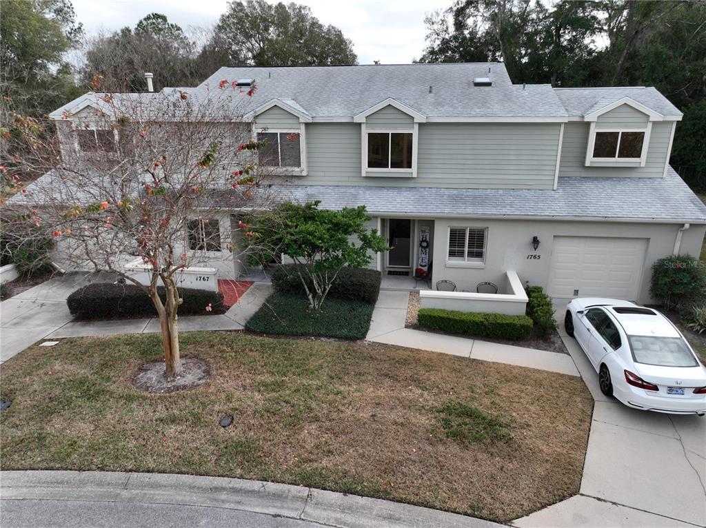 1767 Southeast 27th Loop Ocala, FL 34471 - Photo 3 of 79 a house view with a garden space