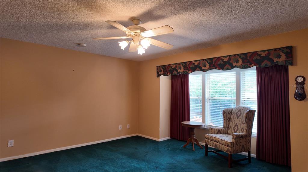 1767 Southeast 27th Loop Ocala, FL 34471 - Photo 32 of 79 a view of a livingroom with furniture and a window