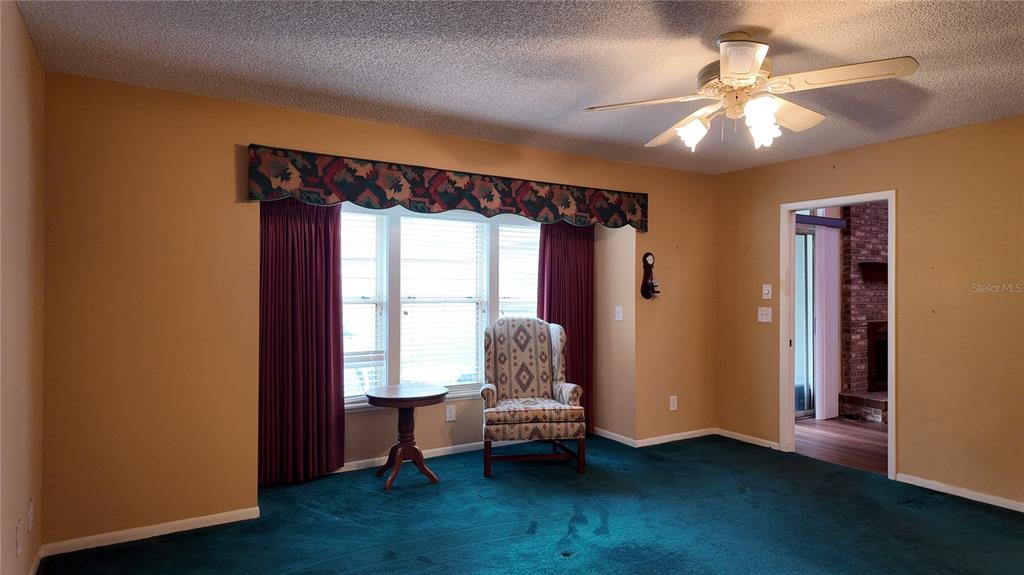 1767 Southeast 27th Loop Ocala, FL 34471 - Photo 33 of 79 a living room with a bed and a window