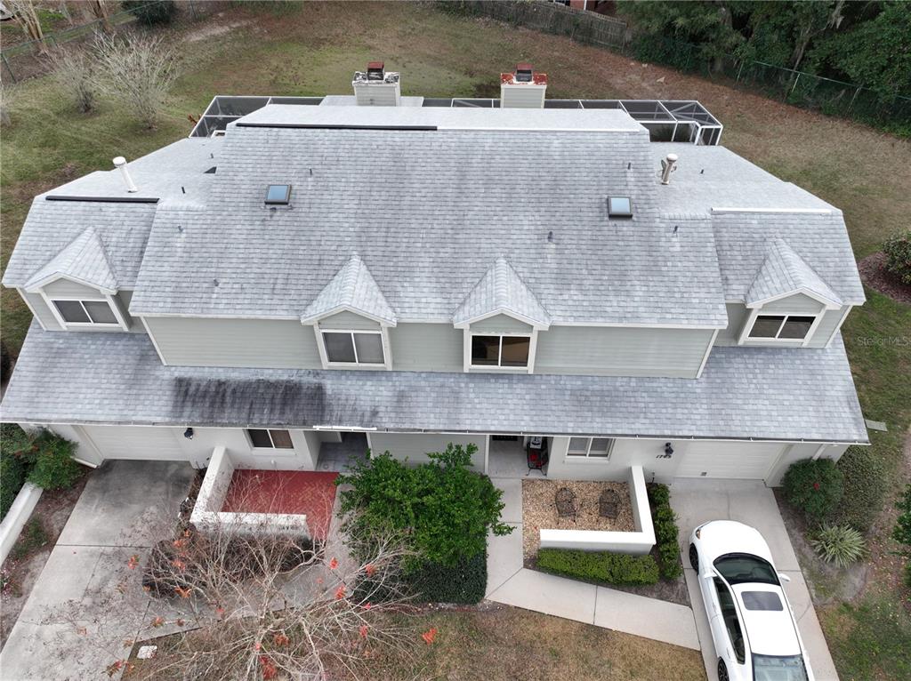 1767 Southeast 27th Loop Ocala, FL 34471 - Photo 4 of 79 an aerial view of a house with a garden and a yard