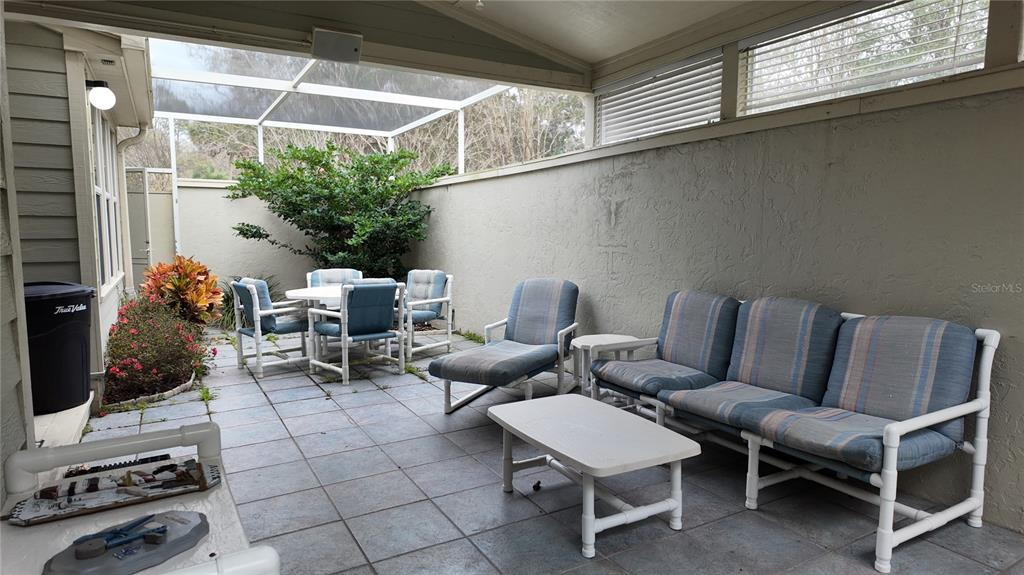 1767 Southeast 27th Loop Ocala, FL 34471 - Photo 45 of 79 a couple of chairs sitting in patio of a house