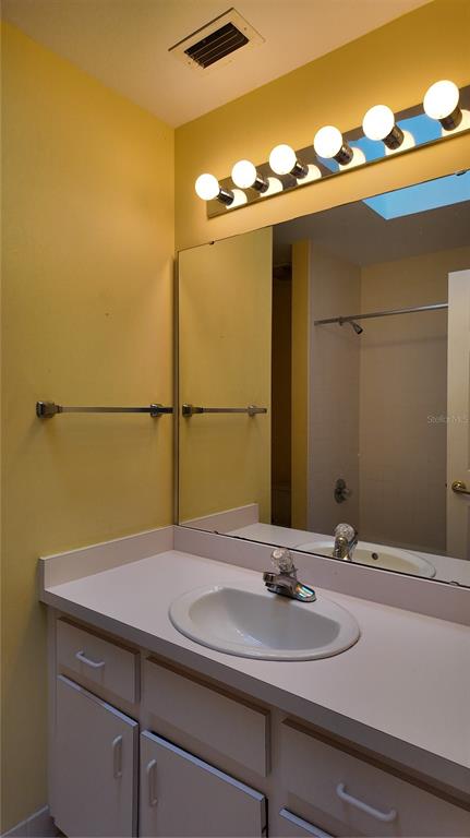 1767 Southeast 27th Loop Ocala, FL 34471 - Photo 56 of 79 a bathroom with a sink and a mirror
