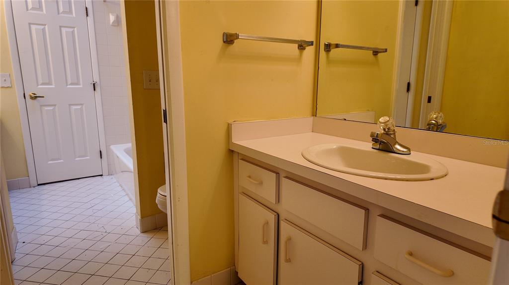1767 Southeast 27th Loop Ocala, FL 34471 - Photo 65 of 79 a bathroom with a sink and a mirror