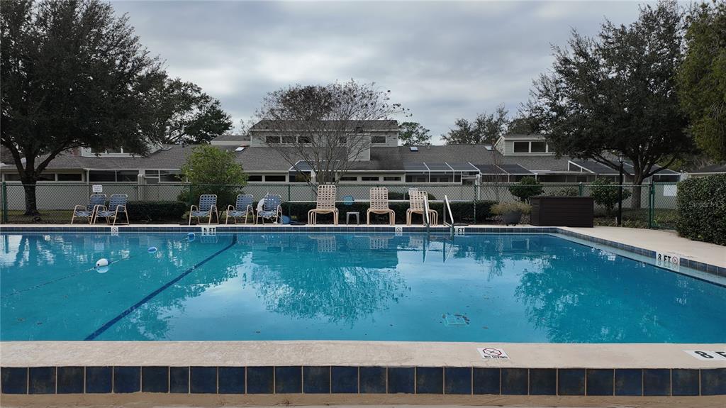 1767 Southeast 27th Loop Ocala, FL 34471 - Photo 78 of 79 a view of swimming pool with outdoor seating and lake view